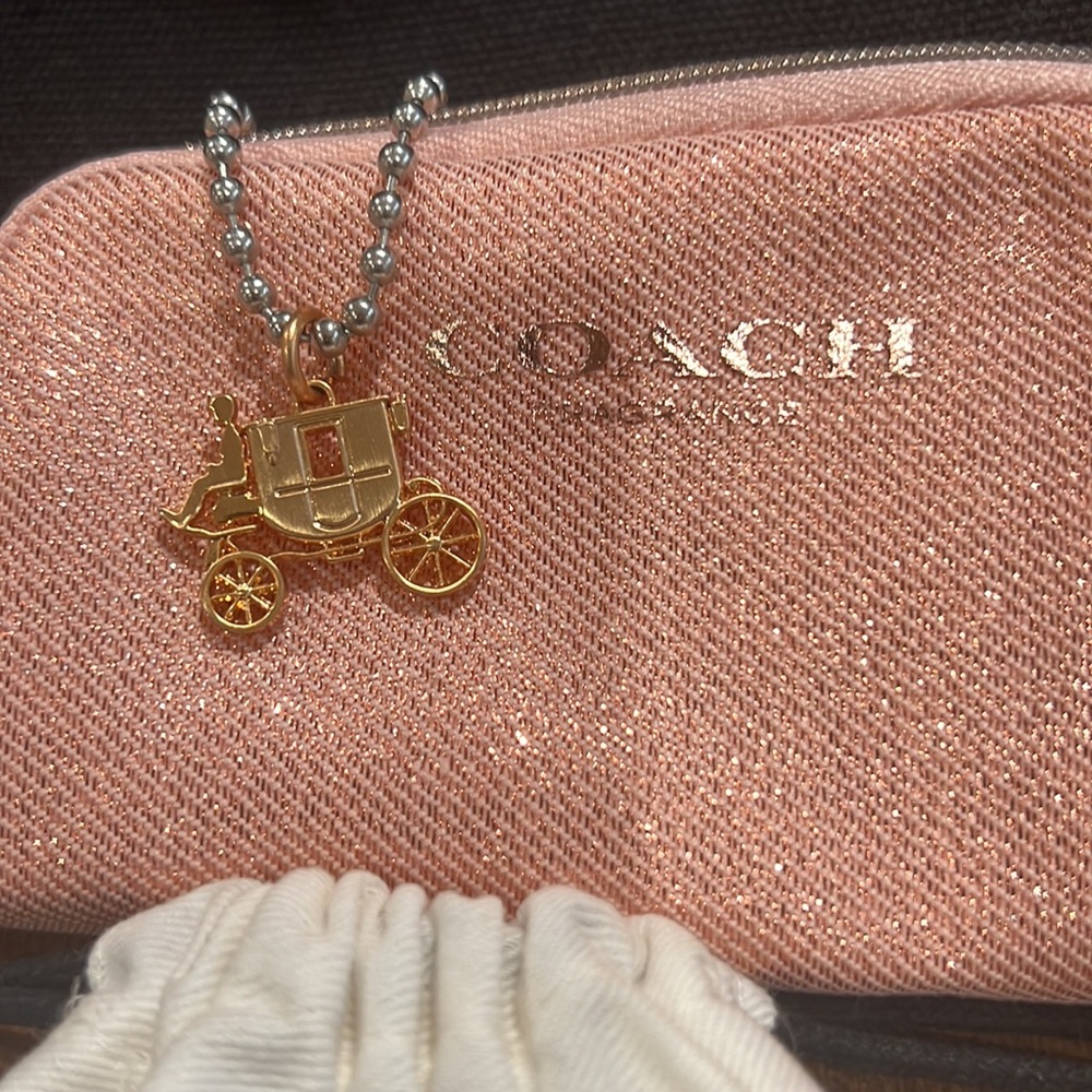 Coach coin purse with limited edition Coach Charm